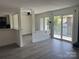 Bright living room with stylish floors, natural light, and an open floor plan at 11123 Harrowfield Rd, Charlotte, NC 28226
