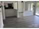 Open-concept living space with modern flooring, natural light, and deck access at 11123 Harrowfield Rd, Charlotte, NC 28226