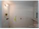 Laundry room features simple design, utility hook, and beadboard walls at 1173 Cat Square Rd, Vale, NC 28168
