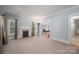 Comfortable living room with fireplace, natural light, and an open doorway to another room at 1173 Cat Square Rd, Vale, NC 28168