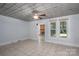 A bright living room featuring tile floors and a glimpse of the fireplace at 1173 Cat Square Rd, Vale, NC 28168