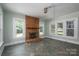Cozy living room featuring a brick fireplace, natural light and tiled flooring at 1173 Cat Square Rd, Vale, NC 28168
