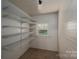 A storage pantry offering multiple shelves and a window for natural light at 1173 Cat Square Rd, Vale, NC 28168