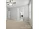 This bedroom features neutral walls, large windows, a ceiling fan, and carpet at 1281 Arges River Dr, Fort Mill, SC 29715