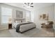This bedroom features neutral walls, large windows, a ceiling fan, and an area rug at 1281 Arges River Dr, Fort Mill, SC 29715