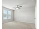 This bedroom features neutral walls, large windows, a ceiling fan, and carpet at 1281 Arges River Dr, Fort Mill, SC 29715
