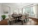 Formal dining room with elegant decor, a chandelier, and large windows providing natural light at 1281 Arges River Dr, Fort Mill, SC 29715