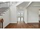 Open foyer with hardwood floors, staircase, and views into the living room, creating a bright and welcoming entrance at 1281 Arges River Dr, Fort Mill, SC 29715