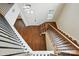Elegant foyer with hardwood floors, staircase with iron railings, and plenty of natural light from the front door at 1281 Arges River Dr, Fort Mill, SC 29715