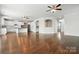 Bright open-concept living area with hardwood floors, white walls, and seamlessly flowing into the kitchen at 1281 Arges River Dr, Fort Mill, SC 29715