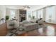 Stylish living room featuring a stone fireplace, modern furniture, and large windows providing ample natural light at 1281 Arges River Dr, Fort Mill, SC 29715