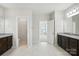 The main bathroom features dual vanities with granite countertops, tile flooring, and separate toilet room at 1281 Arges River Dr, Fort Mill, SC 29715