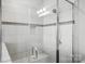 This shower features white tile walls with decorative accents, a built-in seat, and glass enclosure at 1281 Arges River Dr, Fort Mill, SC 29715