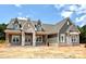 A single-story home featuring board and batten siding, stone accents and a gable roof at 137 Crestview Ln # 16, Troutman, NC 28166