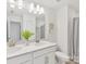 Modern bathroom with double sinks, quartz countertop, and updated lighting fixtures at 1516 Respect Nw St, Concord, NC 28027