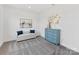 Comfortable bedroom with neutral carpet, daybed, and a chic blue dresser at 1516 Respect Nw St, Concord, NC 28027