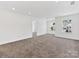 Spacious bonus room featuring neutral carpet, recessed lighting, and bright windows at 1516 Respect Nw St, Concord, NC 28027