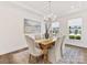 Inviting dining room with natural light, a stylish chandelier, and comfortable seating for Gathering meals at 1516 Respect Nw St, Concord, NC 28027