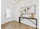 Elegant entryway featuring wood floors, stylish decor, and a welcoming atmosphere at 1516 Respect Nw St, Concord, NC 28027