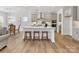 Kitchen boasts a central island with seating, stainless steel appliances, and modern gray cabinetry at 1516 Respect Nw St, Concord, NC 28027