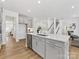 Bright, open kitchen with large island, stainless steel appliances, and hardwood flooring at 1516 Respect Nw St, Concord, NC 28027