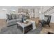 Open living room with hardwood flooring, stainless steel appliances, and kitchen view at 1516 Respect Nw St, Concord, NC 28027