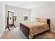 Serene bedroom with carpeted floors, neutral colors, and two windows providing natural light at 154 Cotton Field Dr, Statesville, NC 28677
