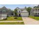 Beautifully landscaped front yard with a charming two-story home featuring a two-car garage and classic design at 154 Cotton Field Dr, Statesville, NC 28677
