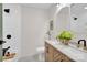 Bathroom featuring dual sinks, a marble countertop, and a white herringbone tile shower at 172 Wildwood Loop, Statesville, NC 28625
