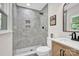 Bathroom features a gray tiled shower, a marble countertop vanity, and a toilet at 172 Wildwood Loop, Statesville, NC 28625