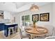 Open-concept dining area with contemporary decor and lots of natural light; ideal for Gathering meals and gatherings at 172 Wildwood Loop, Statesville, NC 28625