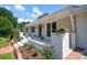 Charming home featuring a welcoming front porch with flower boxes and a freshly landscaped garden bed at 172 Wildwood Loop, Statesville, NC 28625