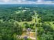 Aerial view of the community with lush green trees, and winding roads at 1916 Bess Town Rd, Bessemer City, NC 28016