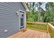 Inviting back porch with wooden deck overlooking a wooded area at 1916 Bess Town Rd, Bessemer City, NC 28016