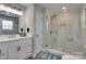 Updated bathroom featuring frameless glass shower, modern vanity, large mirror, and sleek fixtures at 1916 Bess Town Rd, Bessemer City, NC 28016