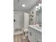 Updated bathroom with white tiled shower, modern vanity, and sleek fixtures at 1916 Bess Town Rd, Bessemer City, NC 28016