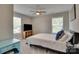 Cozy bedroom with ceiling fan and natural light from the windows at 1916 Bess Town Rd, Bessemer City, NC 28016