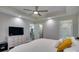 Bright bedroom with tray ceiling, and a view into the bathroom featuring a walk in shower at 1916 Bess Town Rd, Bessemer City, NC 28016