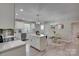 Well-lit kitchen with white cabinets, stainless steel appliances, a kitchen island, and stylish countertops at 1916 Bess Town Rd, Bessemer City, NC 28016