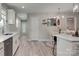 Modern kitchen with bright cabinets, stainless steel appliances, kitchen island and elegant countertops at 1916 Bess Town Rd, Bessemer City, NC 28016