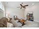Comfortable living room with neutral tones, ceiling fan and stylish furnishings at 20444 Greenway Heights Dr, Cornelius, NC 28031