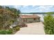Breathtaking aerial view of the house with waterfront location, featuring a spacious driveway and gazebo at 216 Grand View Dr, New London, NC 28127