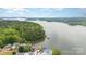 Scenic aerial view of a lake showcasing the lush green landscape at 216 Grand View Dr, New London, NC 28127