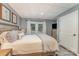 Relaxing bedroom with a neutral palette, features hardwood floors, and french doors to the exterior at 216 Grand View Dr, New London, NC 28127