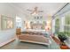 Bright bedroom filled with natural light, features hardwood floors, a comfortable bed and stylish decor at 216 Grand View Dr, New London, NC 28127