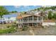 Rear exterior of the home showing the multiple decks, patios, and landscaping at 216 Grand View Dr, New London, NC 28127