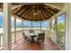 Picturesque gazebo with seating, offering stunning waterfront views, perfect for relaxation and entertaining at 216 Grand View Dr, New London, NC 28127
