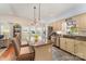 Bright kitchen features granite counters, stainless appliances, and charming breakfast bar with pendant lighting at 216 Grand View Dr, New London, NC 28127
