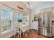 Bright kitchen nook with hardwood floors, a dining table, and stainless steel appliances, creating a cozy and functional space at 216 Grand View Dr, New London, NC 28127