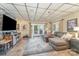 Spacious living area with a stone-accented fireplace and comfortable seating, perfect for relaxation and entertainment at 216 Grand View Dr, New London, NC 28127